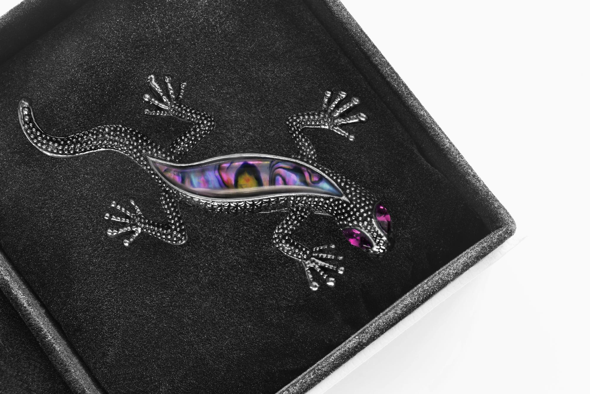 single embroidered sample on dark textile