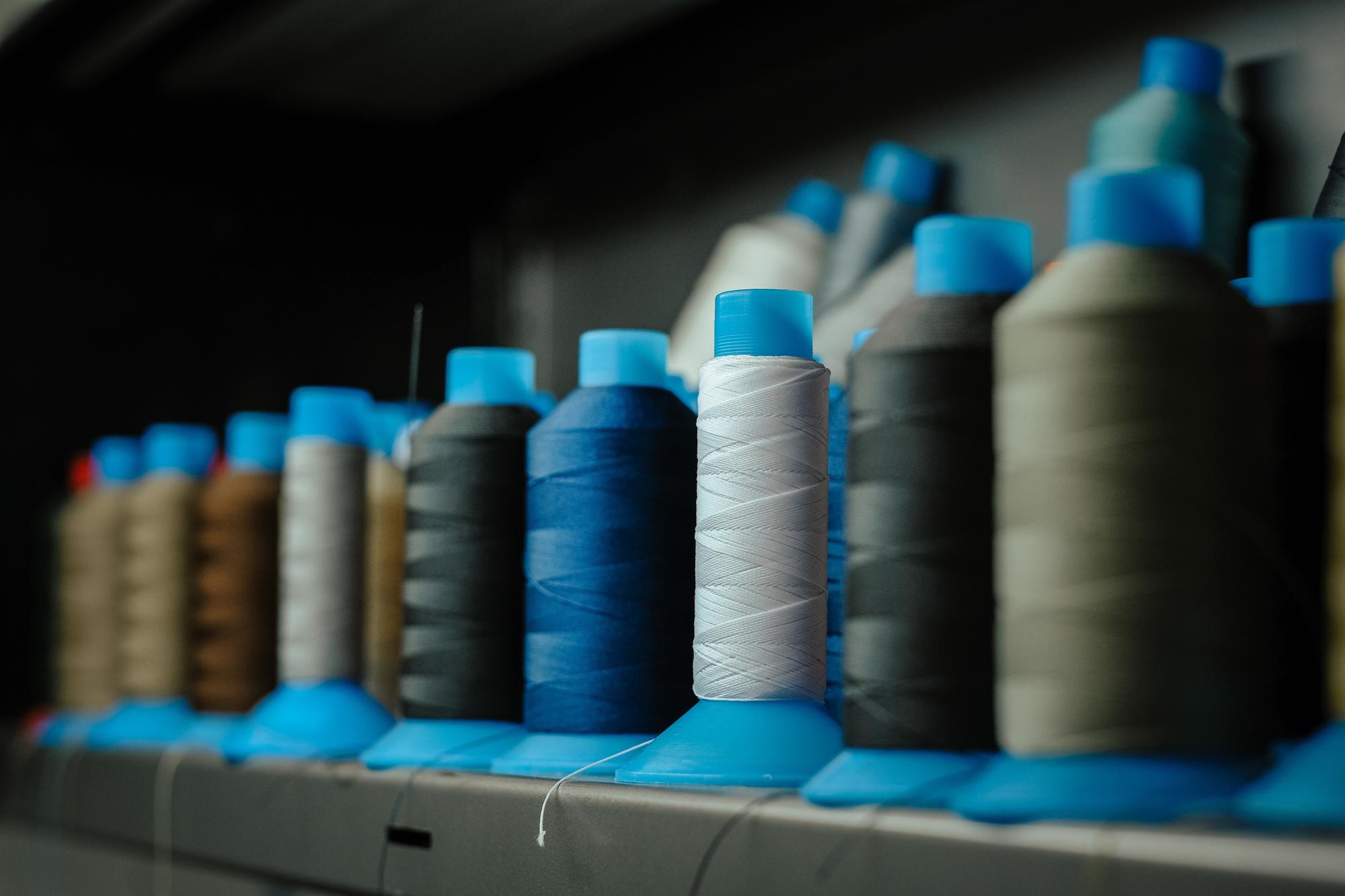rolls of tech fabric ready for batch embroidery